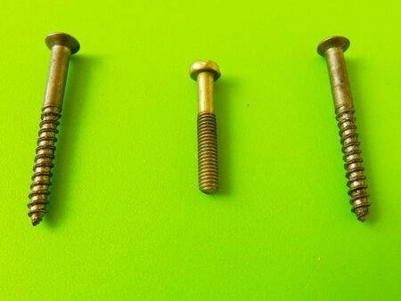 Screw on the green backgroundの写真素材