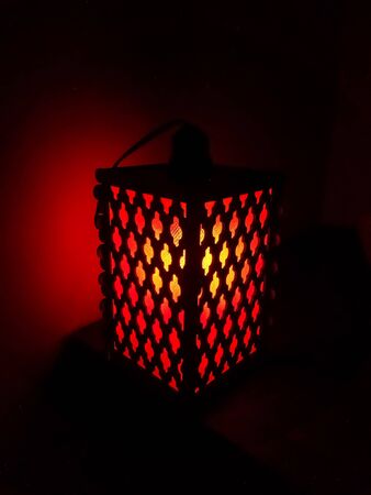 Red lamp dim light inside the dark room square shape lamp boxの写真素材