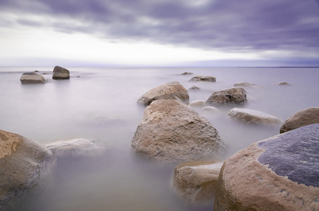 Stones in the fog on Chudskoy lake. Lake Peipsiの写真素材