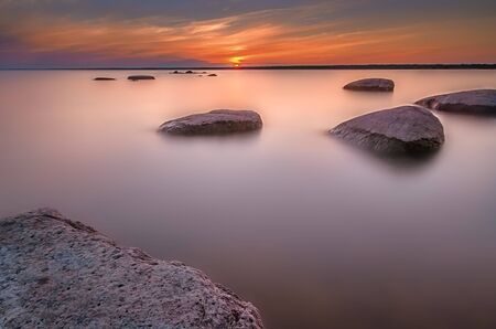 Rock sunset on Chudskoy Lake. Lake Peipsiの写真素材