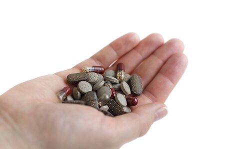 Pills and capsules on hand. Medical themeの写真素材