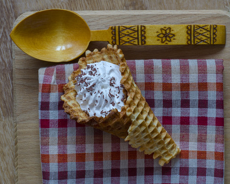 Wrapped in a tubule waffles are very popular in Russia and Belarus. To prepare the tubes used protein cream, chocolate chips and finished wafer sheet or puff pastry.の写真素材