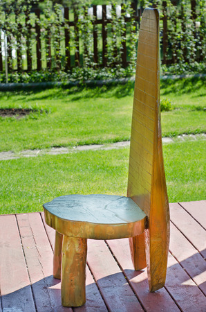 Wooden chair as a variant of garden decorの写真素材