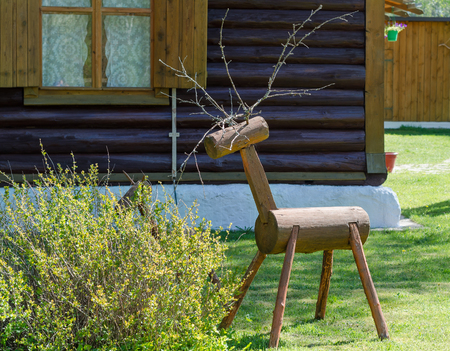 Decorative figure of a deer of a tree trunkの写真素材