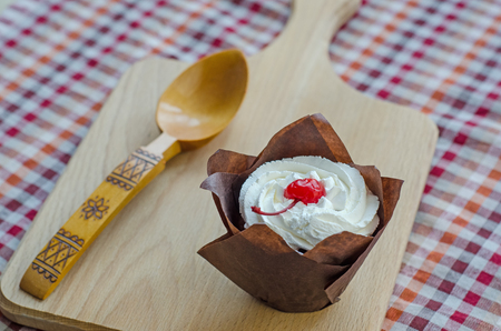 Closeup cake with cherries and cream cheese.の写真素材