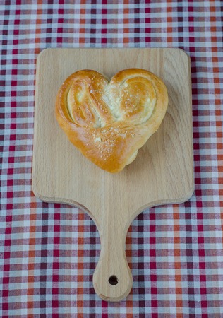Bread in the form of heart on oakの写真素材