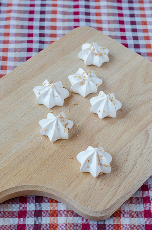 Sweet white meringue on cutting board.の写真素材