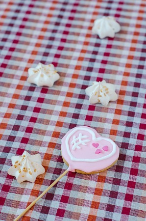 Sweet white meringue and oatmeal cookies in the form of heartsの写真素材
