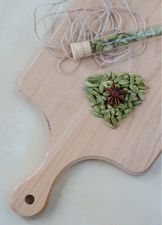 Dry aroma cardamon on the wooden board. Closeupの写真素材