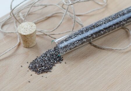 Chia seeds on wooden cutting board. Closeup photo.の写真素材