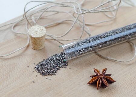 Chia seeds on wooden cutting board. Closeup photo.の写真素材