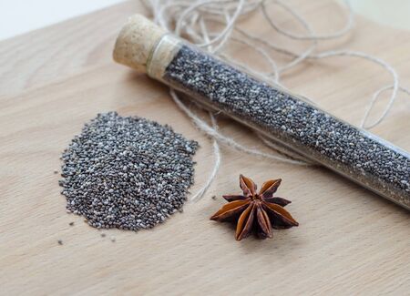 Chia seeds on wooden cutting board. Closeup photo.の写真素材