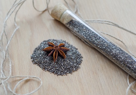 Chia seeds on wooden cutting board. Closeup photo.の写真素材