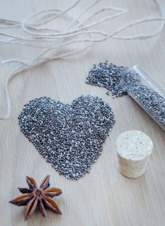 Chia seeds on wooden cutting board. Closeup photo.の写真素材