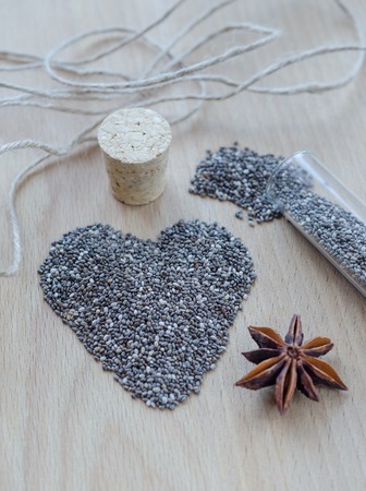 Chia seeds on wooden cutting board. Closeup photo.の写真素材