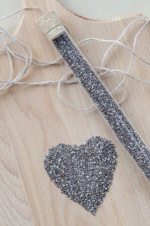 Chia seeds on wooden cutting board. Closeup photo.の写真素材