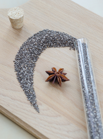 Chia seeds on wooden cutting board. Closeup photo.の写真素材