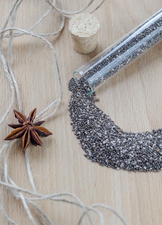Chia seeds on wooden cutting board. Closeup photo.の写真素材