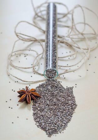 Chia seeds on wooden cutting board. Closeup photo.の写真素材