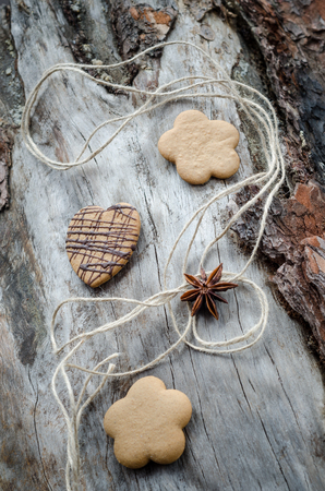 Oat cookies with chocolate on aged woodの写真素材