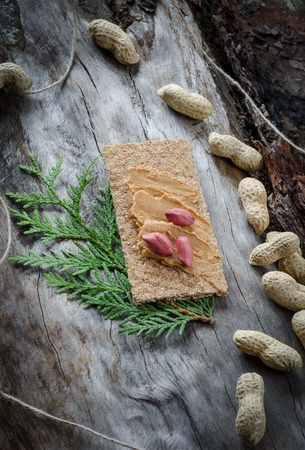 Sandwich with peanut butter on the background of old wood. Closeupの写真素材
