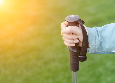 Woman hiker walks at sunset. Closeup shotの写真素材
