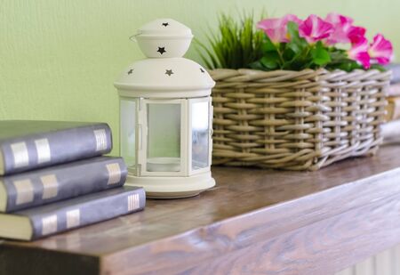 Book, white lights and flowers on the shelf. Closeupの写真素材