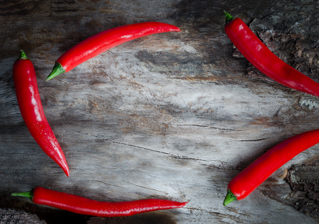 Red chillies on aged wood background. Closeupの写真素材