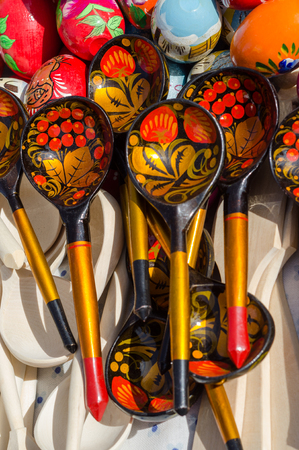 Old wooden painting handicraft style spoons and national ornament.の写真素材