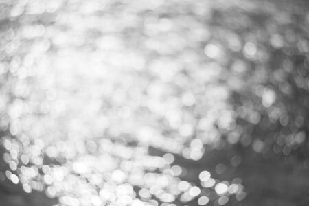 Blurry background of bokeh on water riverの写真素材