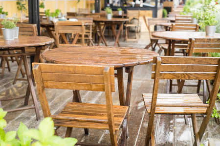 A tables and many chairs on a terrace on a summer dayの写真素材
