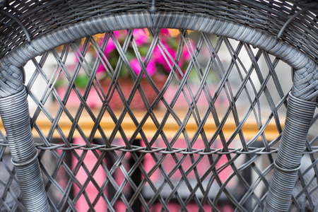 flower pot with magenta flowers hang on the streetの写真素材