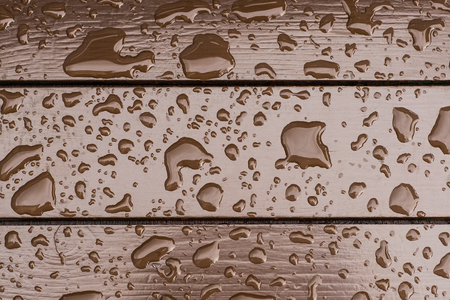 Wet wooden floor during rain, abstract background.の写真素材