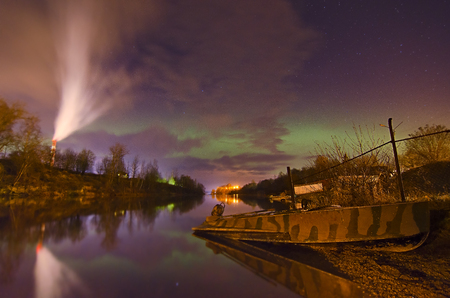 Lights above the lake,man with a dog-Aurora borealis.の写真素材