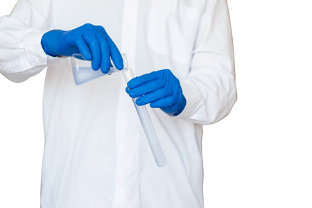 Male scientists mixing reagents in lab conditionsの写真素材
