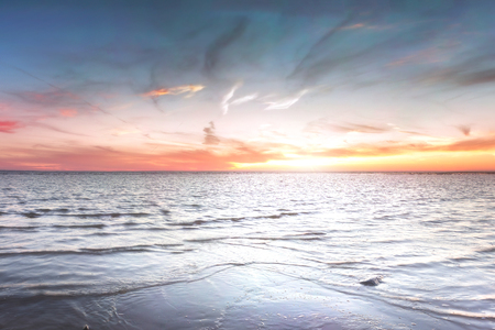 Sandy beach with rocks and foaming. Estonia.の写真素材