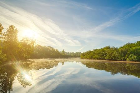 Boats on river at beautiful summer sunrise.の写真素材