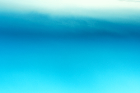 Abstract blue background with bokeh defocused lightsの写真素材