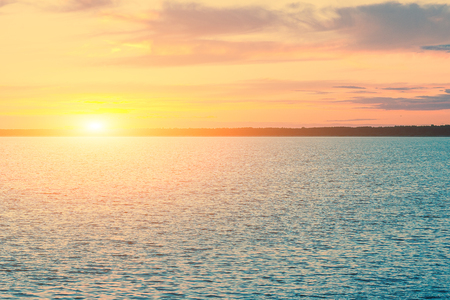 Nice landscape with sunset on lake.の写真素材