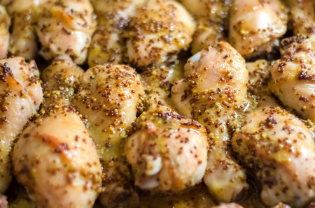 Many roasted chicken legs with Dijon mustard, selective focusの写真素材