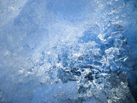 Close-up of cracked ice texture on river in spring timeの写真素材