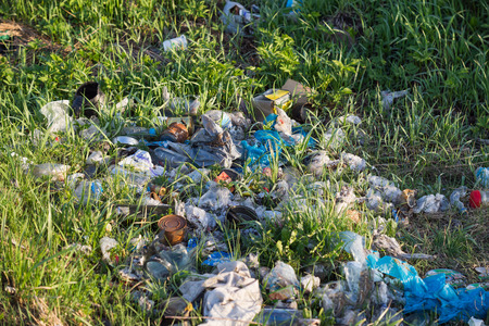 Pile of garage on green grass in the nature environment problems. Nature protectionの写真素材