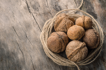 Walnuts kernels on wooden logの写真素材