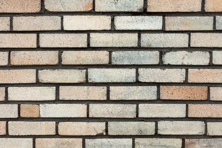 The old rectangular grey brick wall texture background.の写真素材