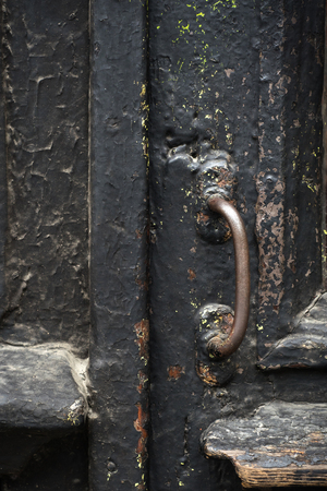 old wooden entrance door with antique door handleの写真素材