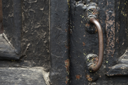 old wooden entrance door with antique door handleの写真素材
