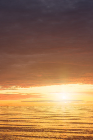 Red Sunset Over the Sea, Rich In Dark Clouds, Rays Of Light. Morning Glory In Heaven.の写真素材