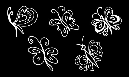 Set of hand drawn butterflies isolated on black background. Vector doodled elements for decoration.のイラスト素材