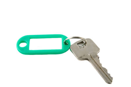 plastic keyholder with key on white backgroundの写真素材