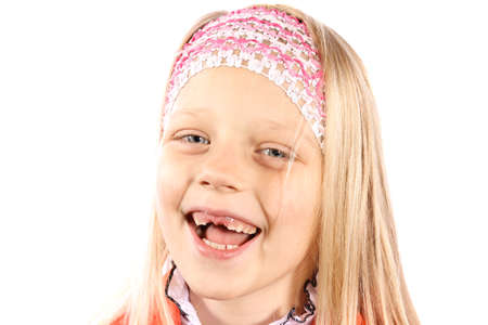 A little girl who is missing a front tooth. 